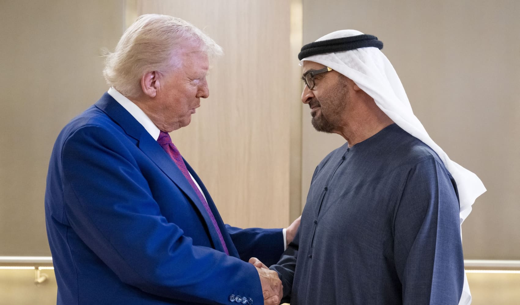 UAE President Sheikh Mohamed bin Zayed Al Nahyan (R) welcomes U.S. President Donald Trump upon arrival at the presidential terminal in Abu Dhabi on May 15, 2025.