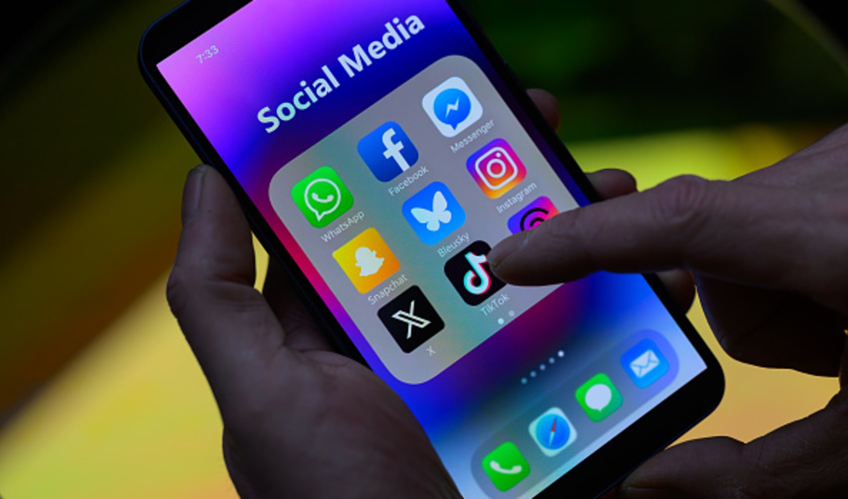 Social media application icons, including TikTok’s, are seen on a mobile phone.