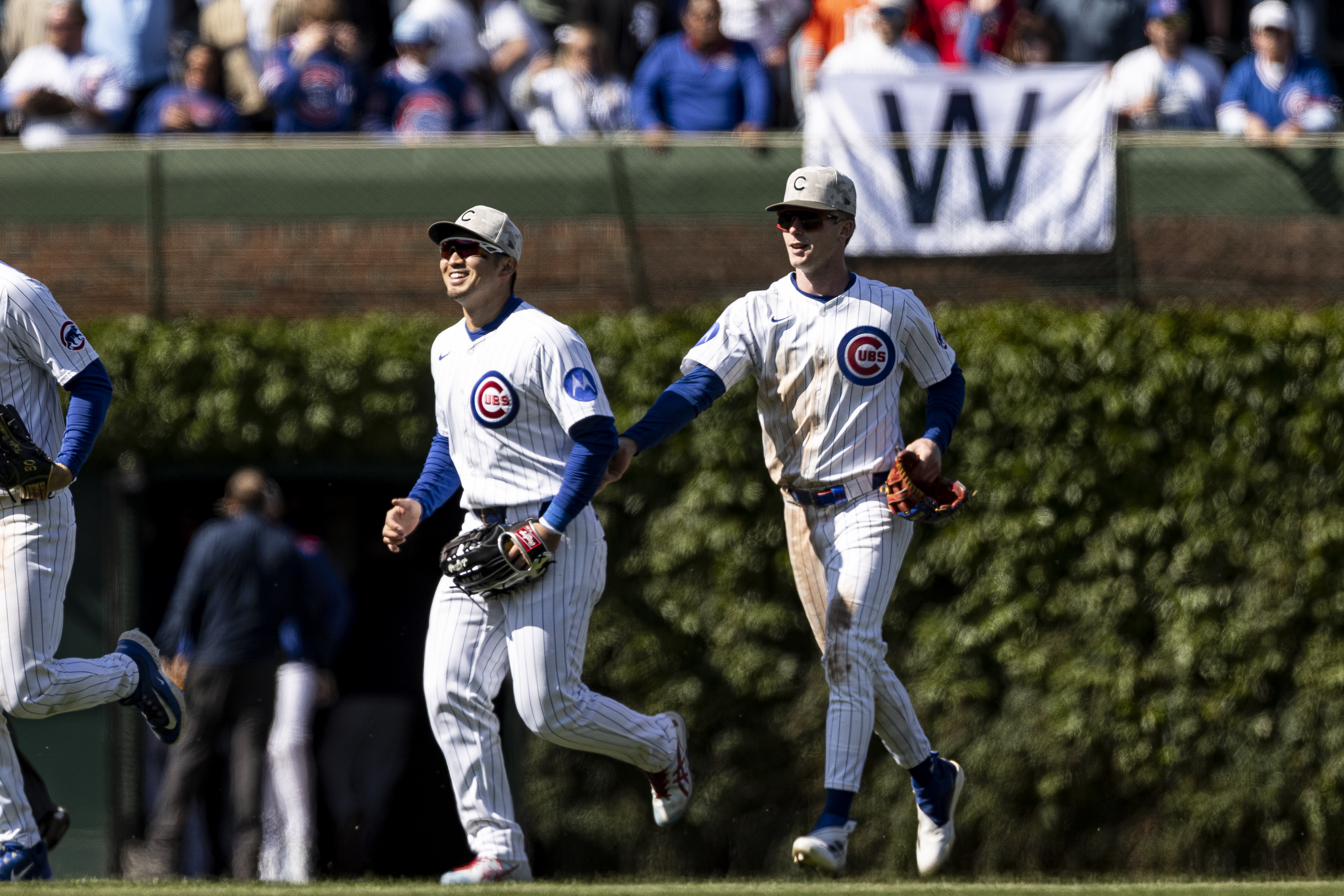 CHICAGO, ILLINOIS – MAY 18: Seiya Suzuki #27 and Pete Crow-Armstrong of the Chicago Cubs celebrate after defeating the Chicago White Sox 6-2 at Wrigley Field on May 18, 2025 in Chicago, Illinois. (Photo by Griffin Quinn/Getty Images)